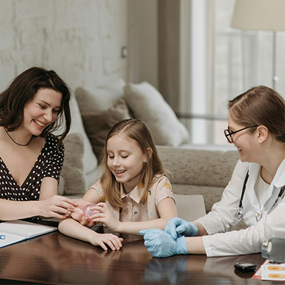 Doctor with child and mother talking about functional medicine